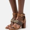 MICHAEL Michael Kors Damen IZZY T STRAP - High Heel Sandalette - Brown/multi-coloured