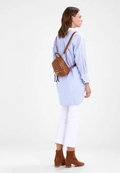 MICHAEL Michael Kors Damen RHEA ZIP XS BACKPACK - Tagesrucksack - Tan -MICHAEL Michael Kors Geschäft 828bf301ae1747ab92bb1c292a972330